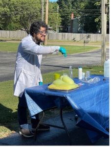 Daniel Padilla performing a science experience for students at Truman Elementary